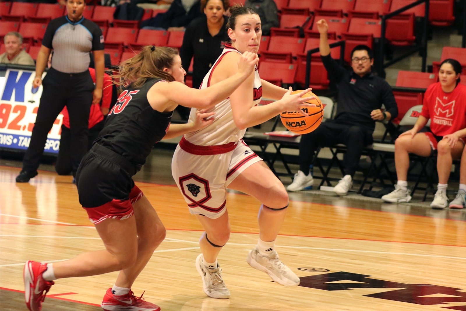 Reese Schaaf, wearing a Drury women's basketball uniform, dribbles the ball during a game.