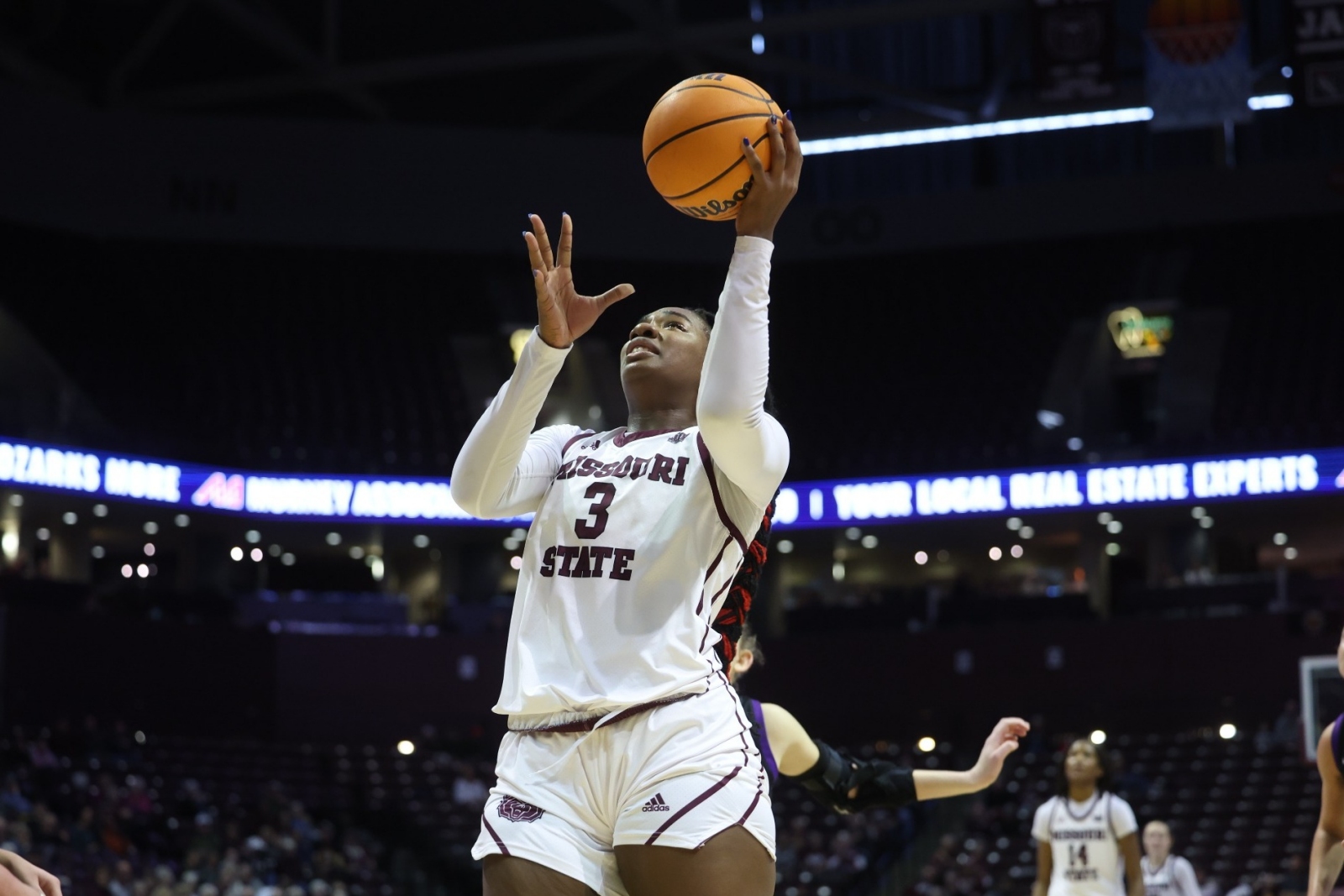Kennedy Taylor, wearing a Missouri State Lady Bears basketball uniform, shoots the ball during a game.