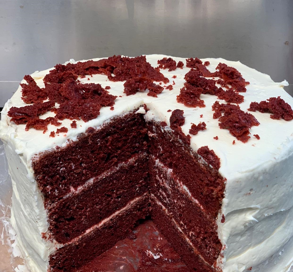 A red velvet cake after a slice has been taken out