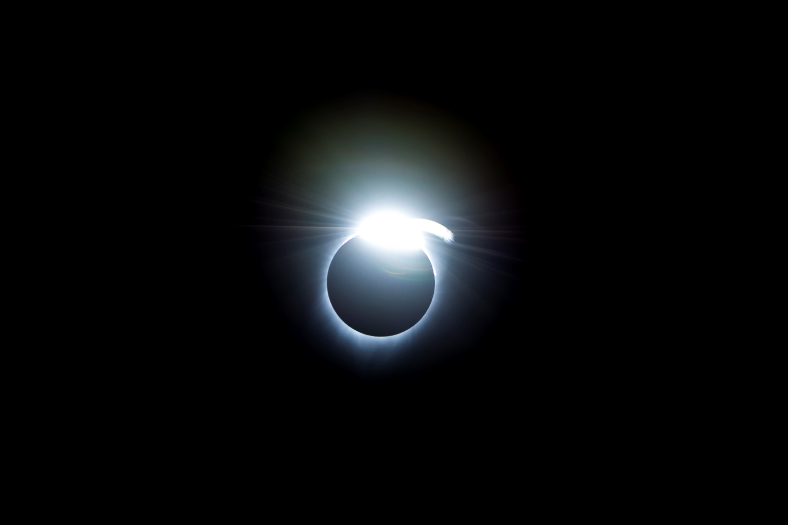 The diamond-ring effect occurred at the beginning and end of totality during a total solar eclipse. As the last bits of sunlight pass through the valleys on the moon's limb, and the faint corona around the Sun is just becoming visible, it looks like a ring with glittering diamonds on it.