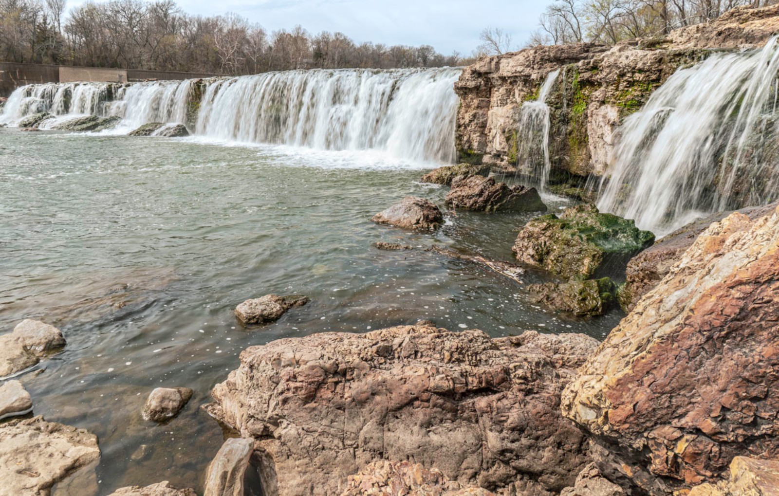 The impressive Grand Falls attracts locals and visitors to enjoy picnicking, splashing and playing. You can see the waterfall from the parking lot and up close by walking down a short dirt path or scrambling over the solid rock bank. (Photo by Sony Hocklander)
