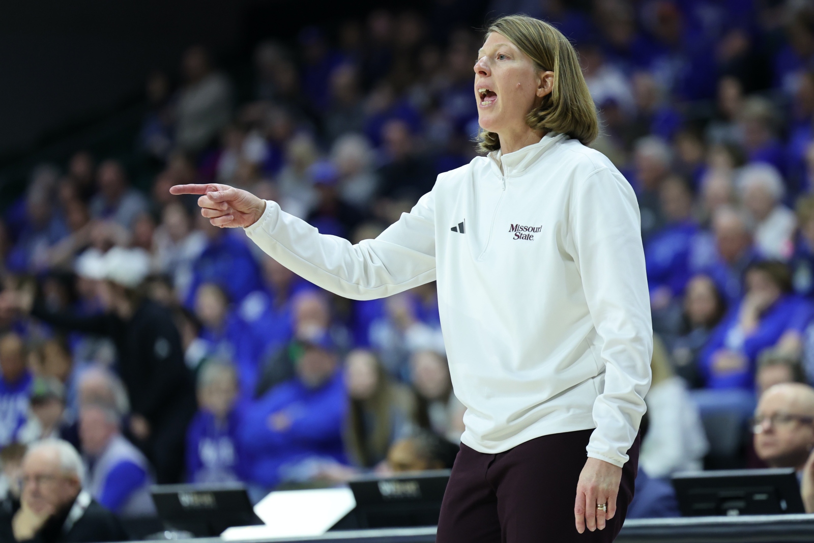 Missouri State Lady Bears basketball coach Beth Cunningham shouts instructions to her team during a game.