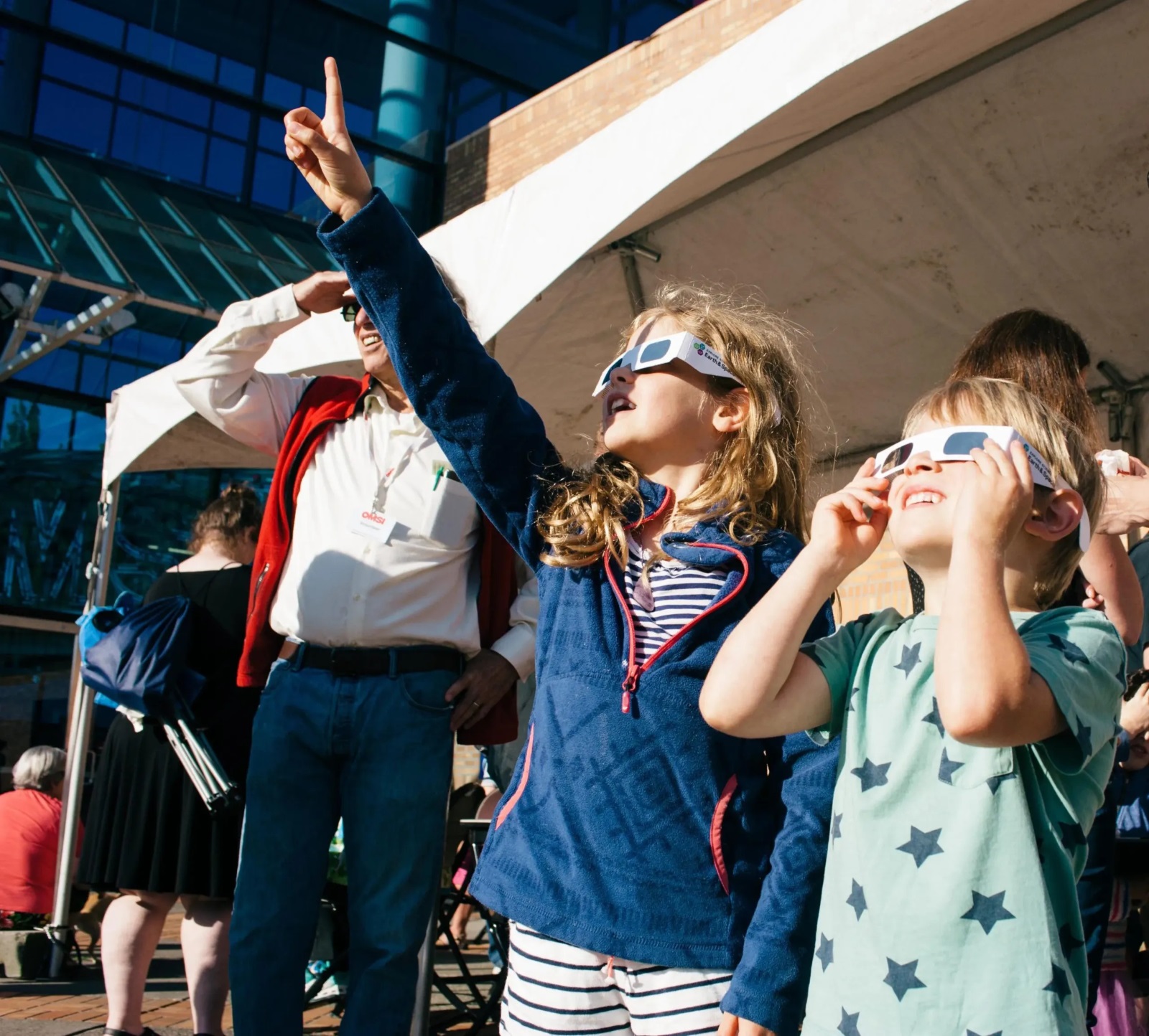 Children use special glasses to look at a solar eclipse in 2017