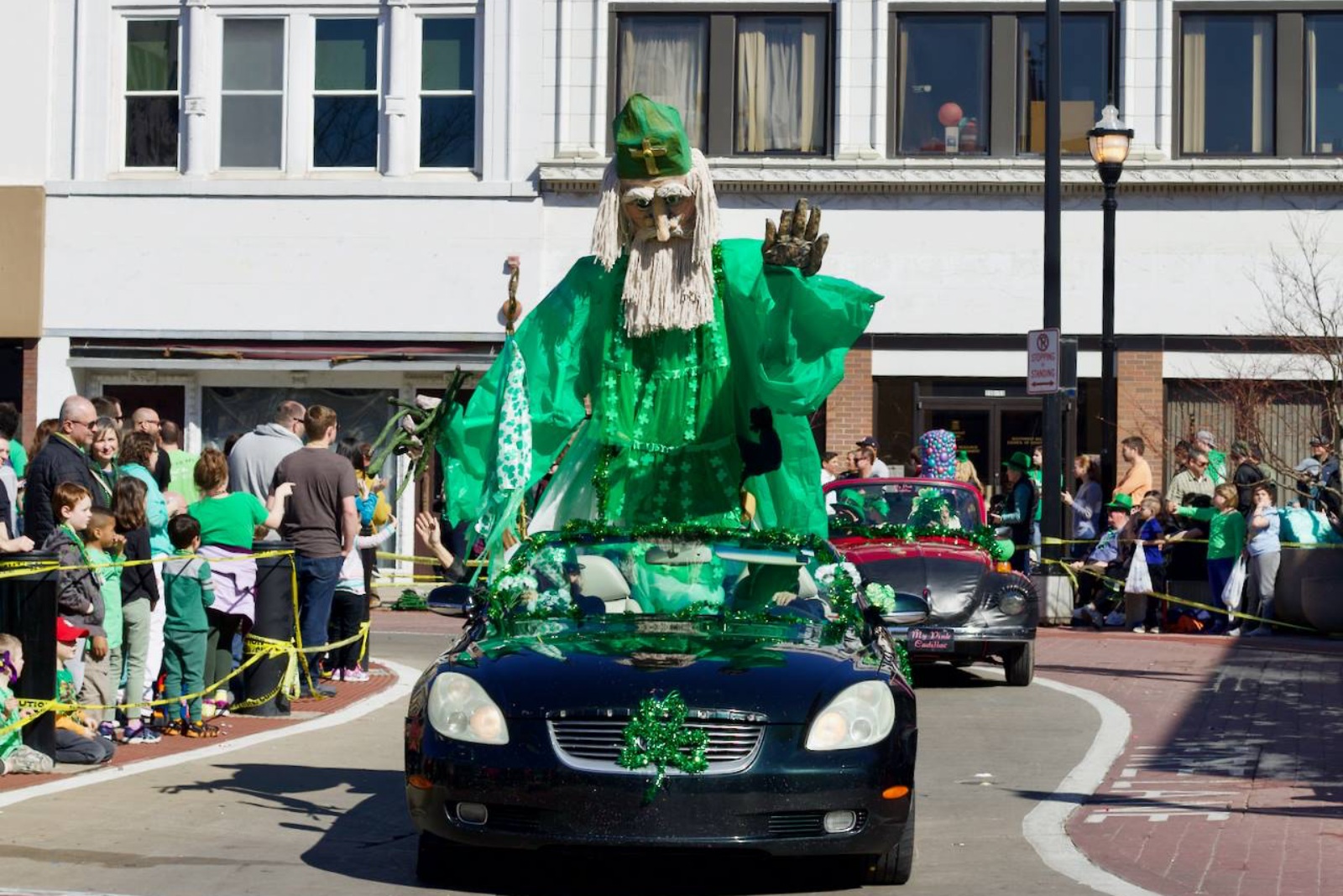 A float of St. Patrick drives through Park Central Square during the Springfield St. Patrick's Day Parade