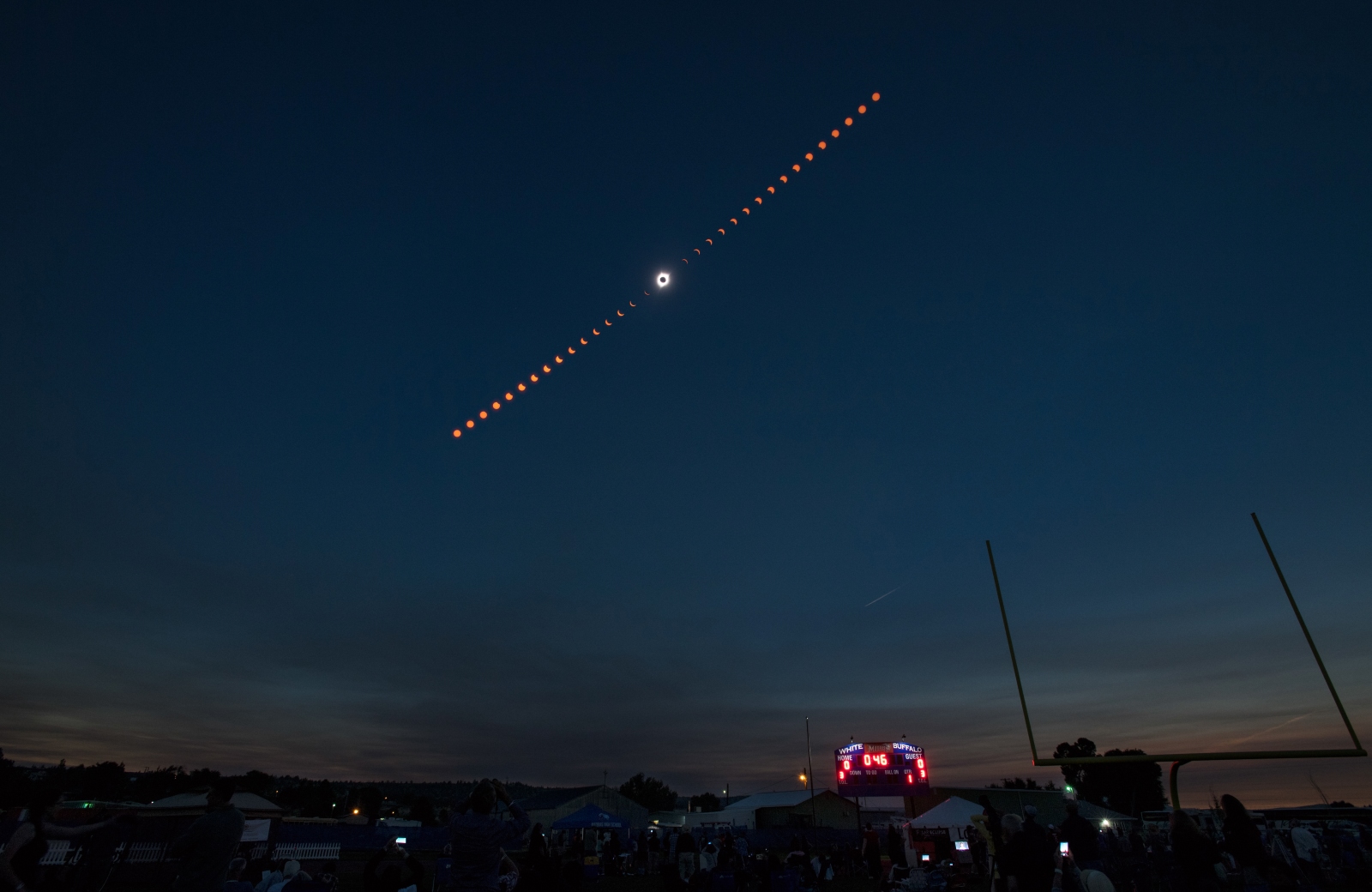 This composite image shows the progression of a total solar eclipse over Madras, Oregon, on Monday, Aug. 21, 2017.