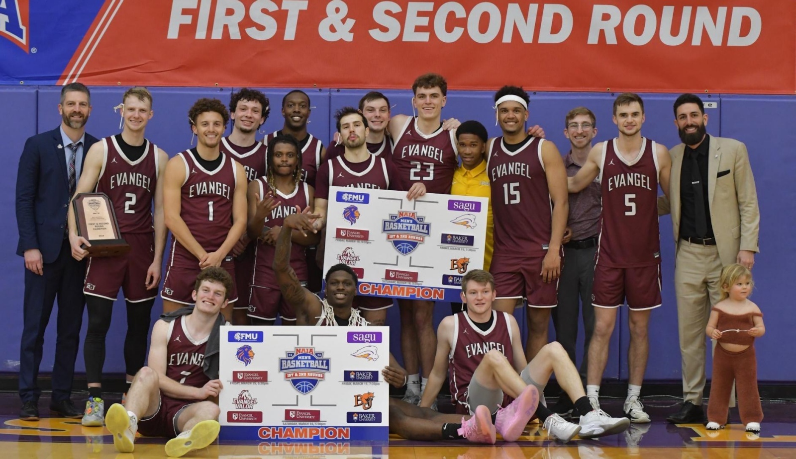 The Evangel Valor men's basketball team poses for a photo after clinching a spot in the Round of 16 at the NAIA National Tournament.