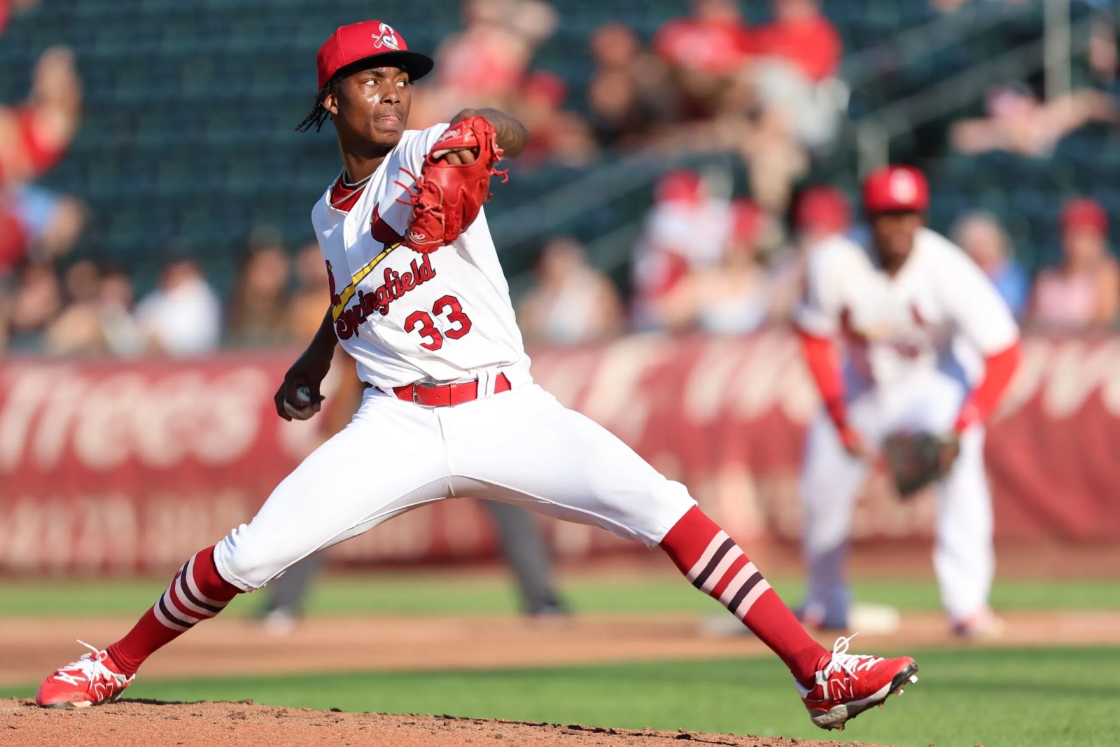 Tink Hence, wearing a Springfield Cardinals uniform, pitches during a game at Hammons Field