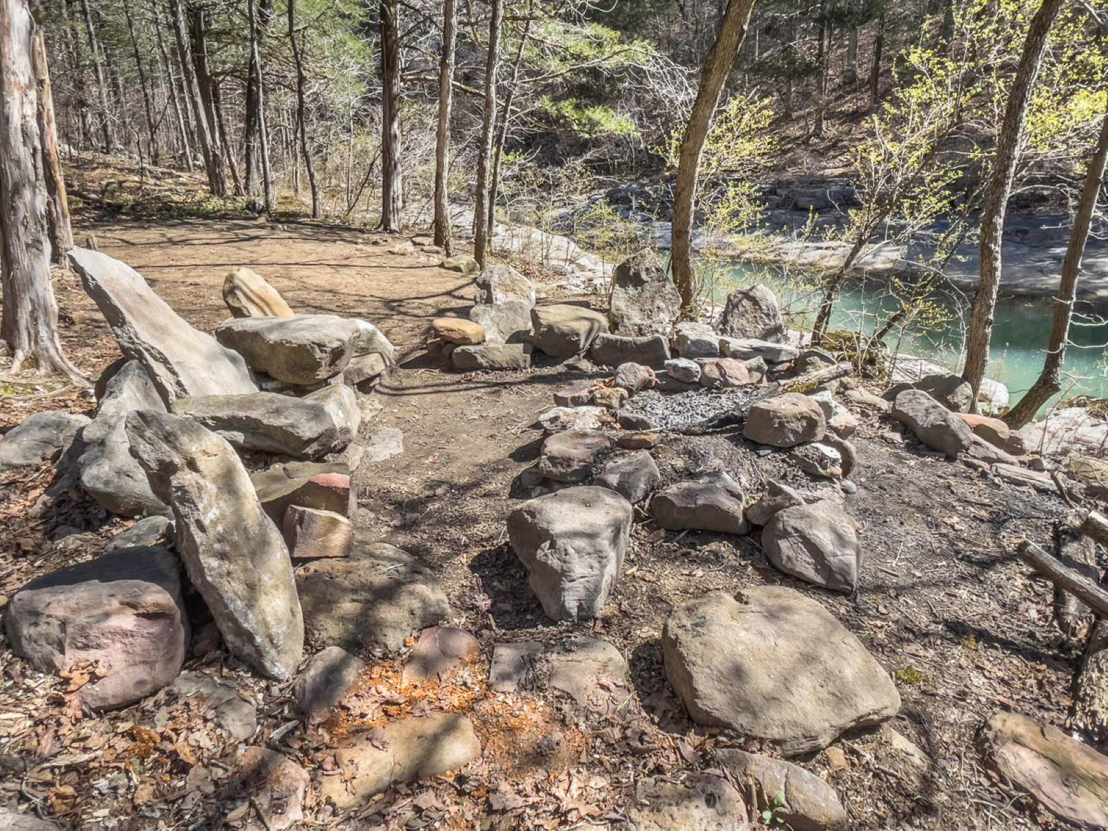 A close view of the firepit and rock chairs near Cecil Creek. (Photo: Sony Hocklander)