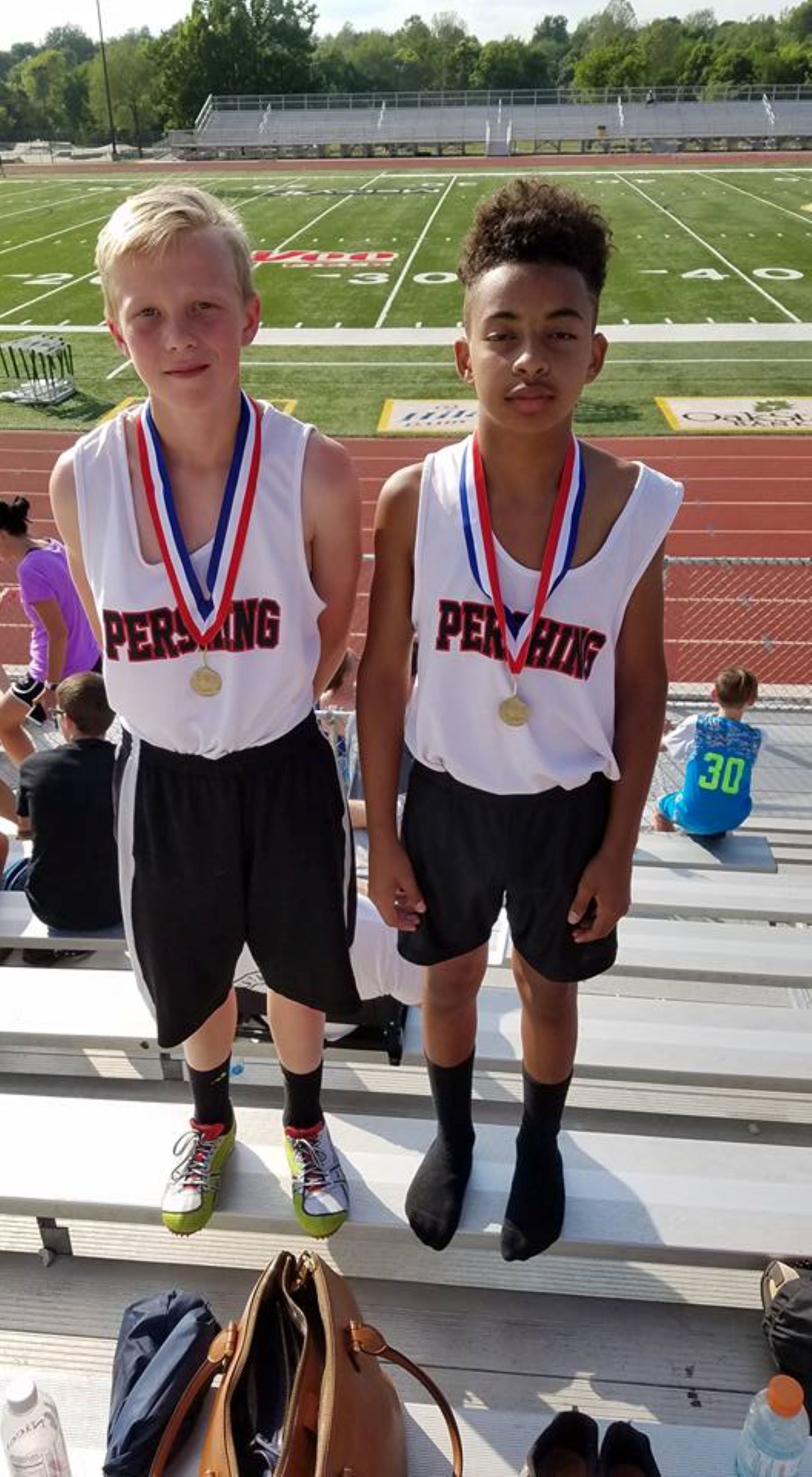 Deverin King (on right) is pictured with a teammate from his days with the Pershing Middle School track team