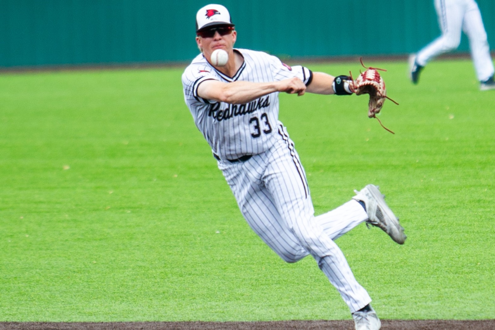 Brooks Kettering, wearing a Southeast Missouri State baseball uniform, throws the ball across the infield during a game.