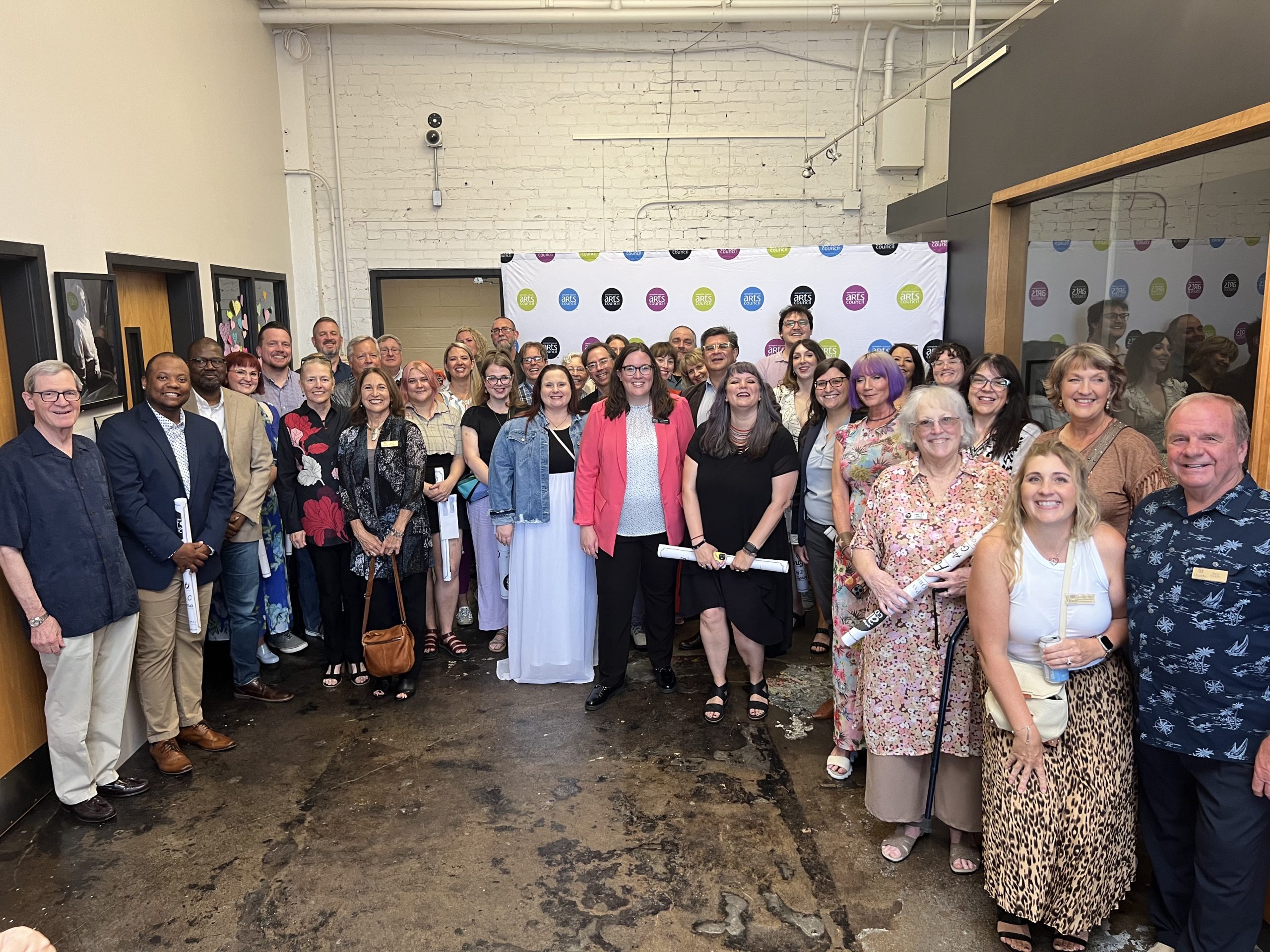 A group photo of Arts & Culture Grants recipients, taken inside the Creamer Arts Center in Springfield, Missouri.