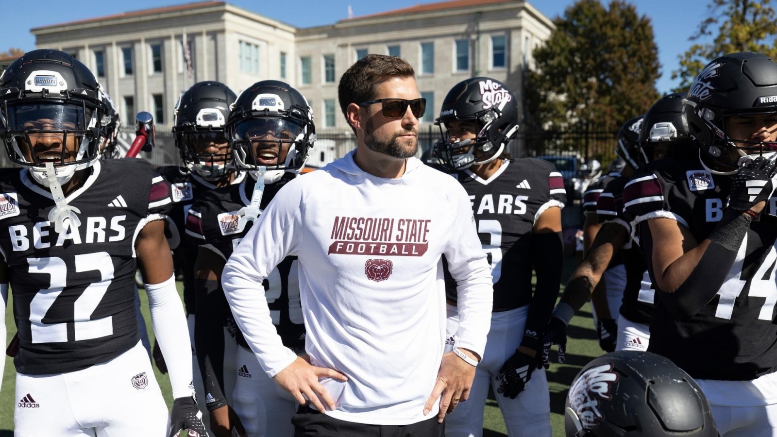 Ryan Beard stands in front of his Missouri State Bears football team as they prepare to run onto the field at Plaster Stadium.