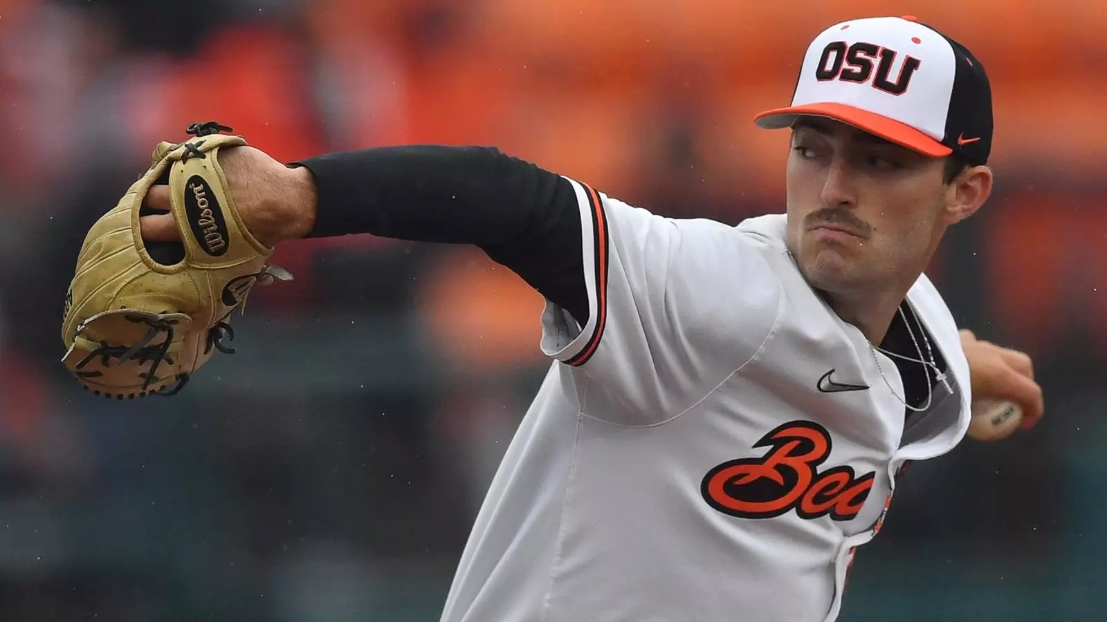 Cooper Hjerpe, wearing an Oregon State Beavers uniform, pitches the baseball during a game.