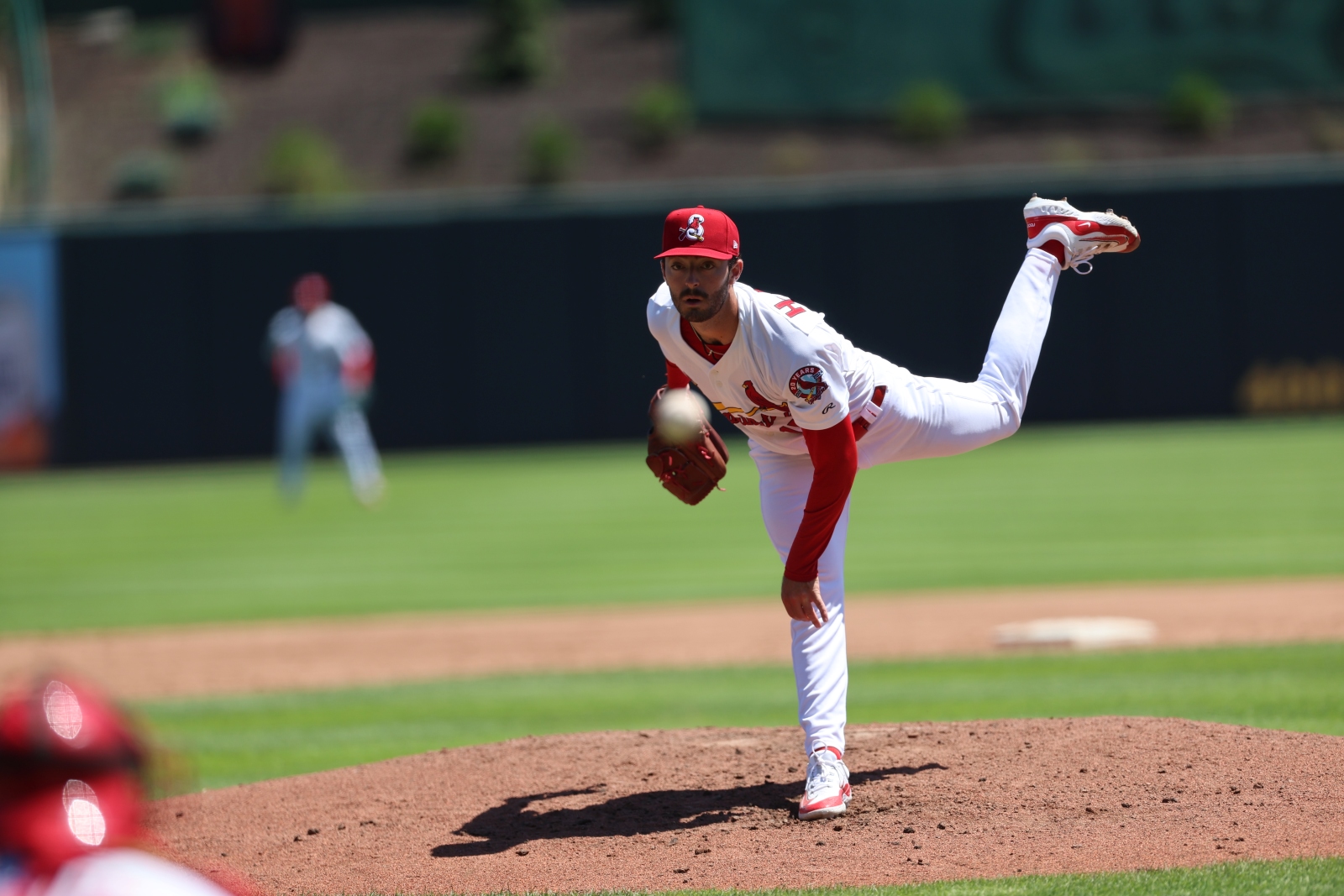 Cooper Hjerpe, wearing a Springfield Cardinals uniform, pitches the baseball during a game at Hammons Field in Springfield, Missouri.