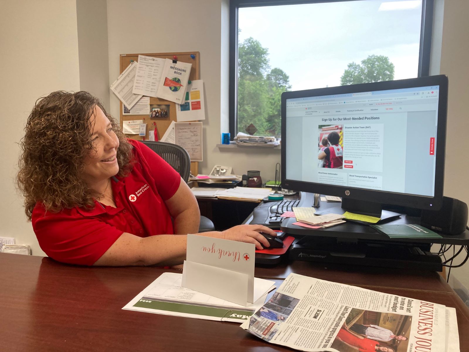 Red Cross Southern Missouri Chapter Executive Director Stacy Burks demonstrates how to find out about volunteer opportunities on the Red Cross website.