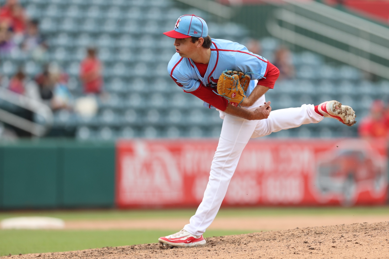 Ian Bedell, wearing a Springfield Cardinals uniform, pitches the baseball during a game at Hammons Field in Springfield, Missouri.