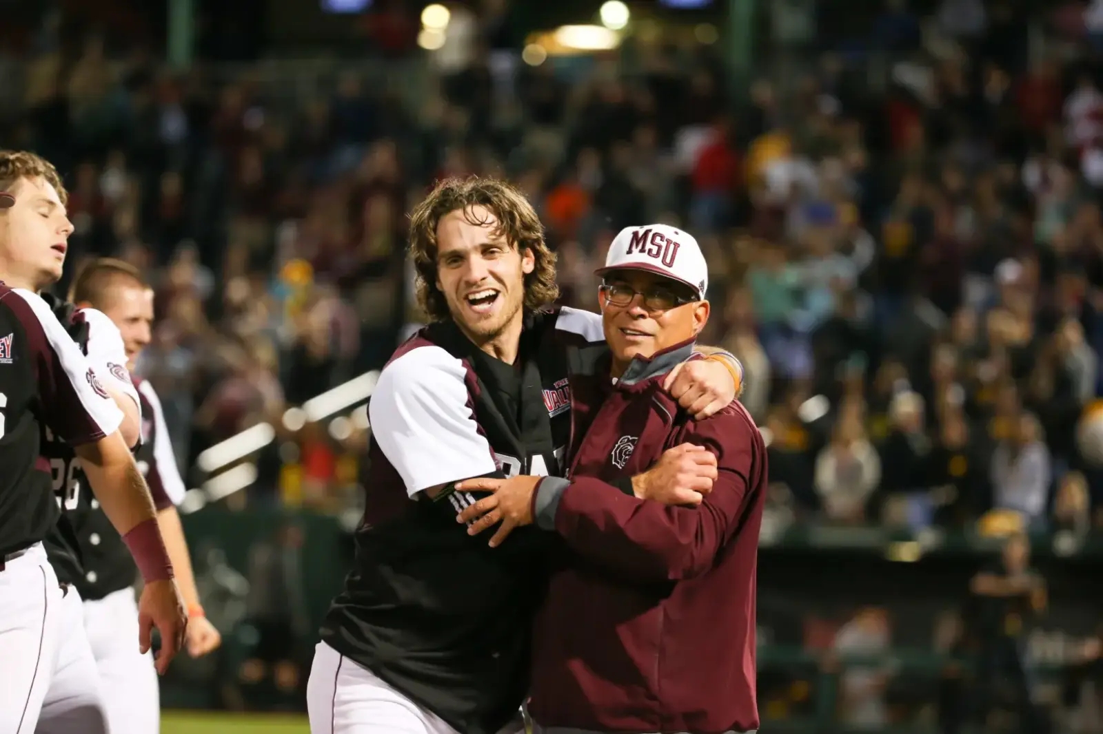 Nine years since Joey Hawkins celebrated the NCAA Springfield Regional championship with Coach Keith Guttin, he’s taking over as head coach of the Bears. (Photo by Missouri State University)