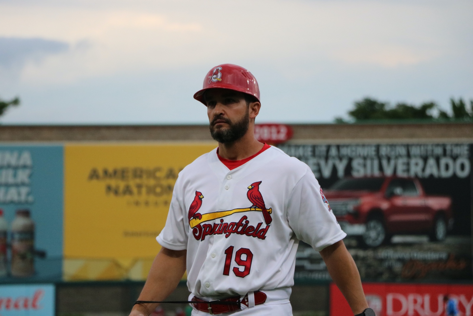 Jose Leger, wearing a Springfield Cardinals uniform, walks toward the dugout at Hammons Field.