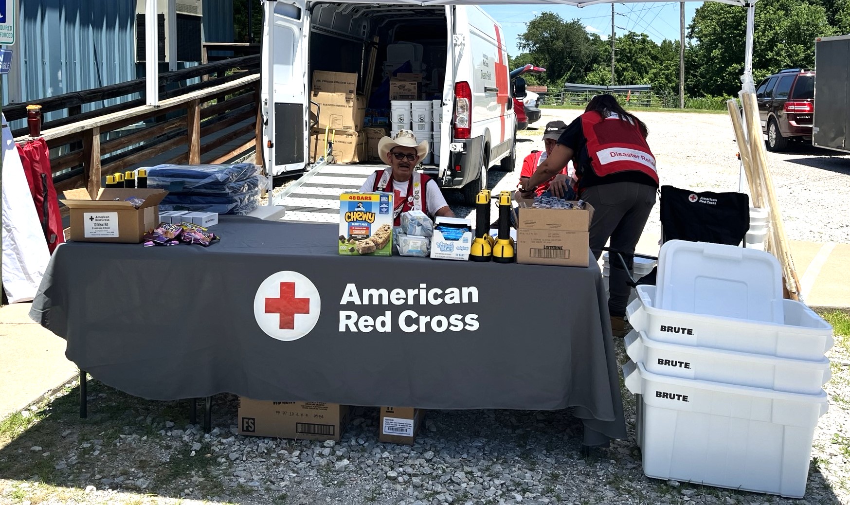 Volunteers with the American Red Cross distribute supplies to residents of Decatur, Arkansas following the tornado that hit over the Memorial Day weekend.