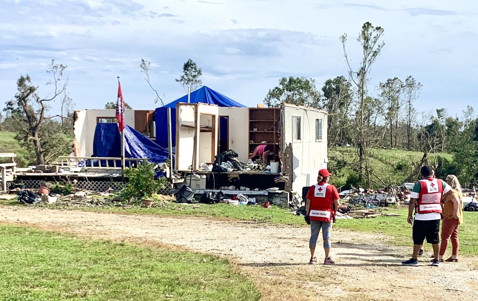 Volunteers with the American Red Cross talks to residents of Decatur, Arkansas following the tornado that hit over the Memorial Day weekend.