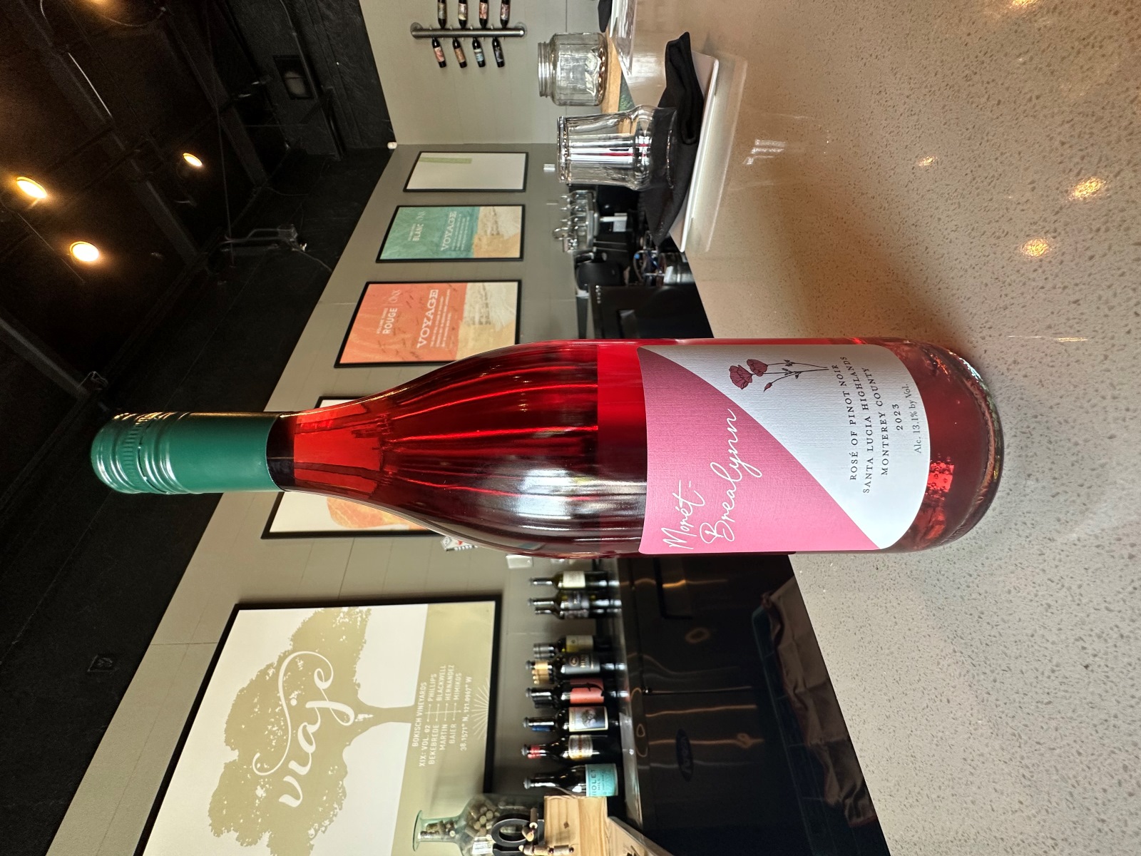 A bottle of Morét-Brealynn rosé sits on a table